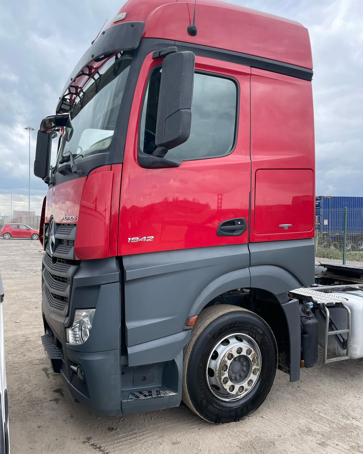 Clean red Mercedes Actros HGV prepared on a commercial site