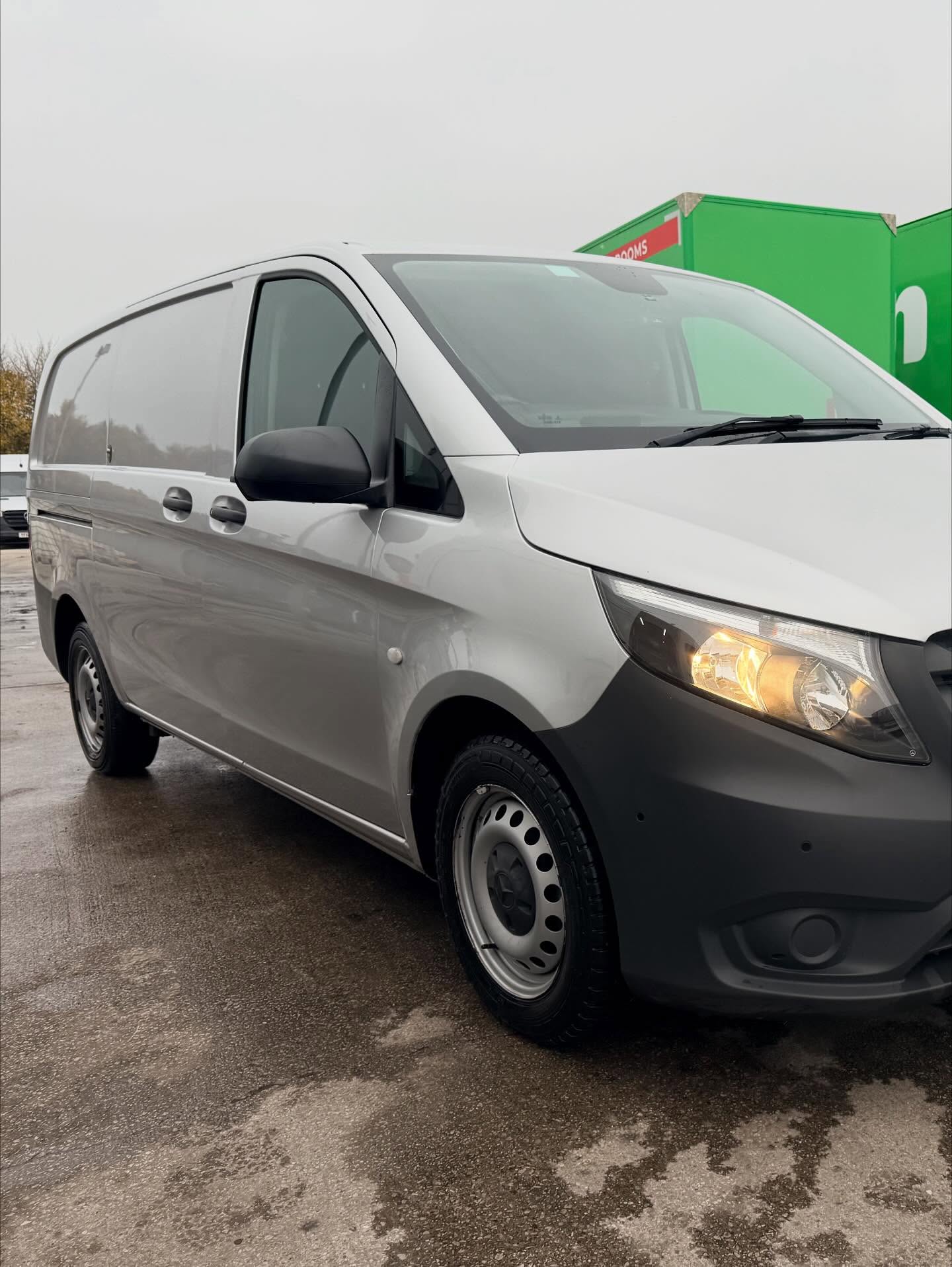 Clean black Mercedes Vito commercial van outside a commercial site